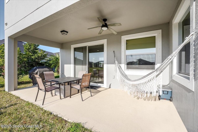 view of patio featuring ceiling fan