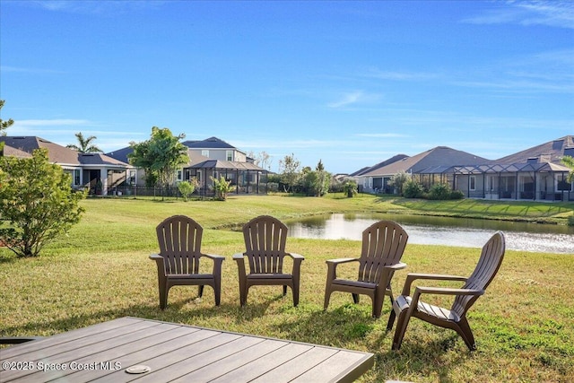 deck featuring a water view and a yard