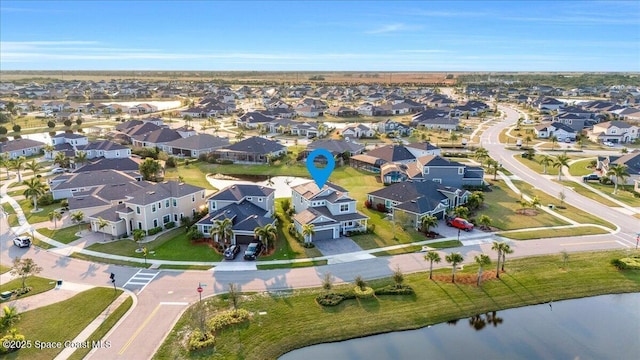 birds eye view of property featuring a water view