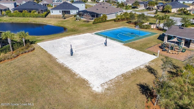 view of swimming pool featuring a water view, basketball hoop, a playground, and volleyball court