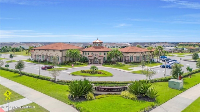 view of home's community featuring a lawn