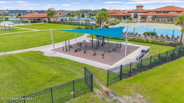 view of playground with a lawn