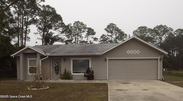 single story home with a garage and a front yard