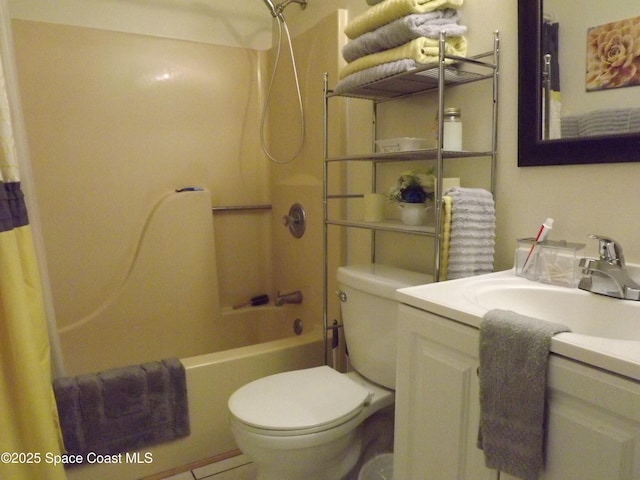 full bathroom with shower / bath combination with curtain, vanity, and toilet