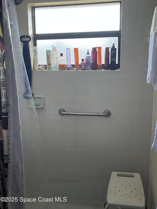 bathroom with a shower with shower curtain