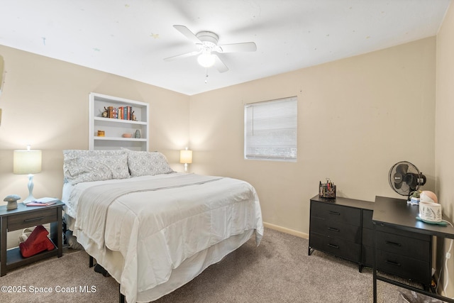 bedroom with light carpet, ceiling fan, and baseboards