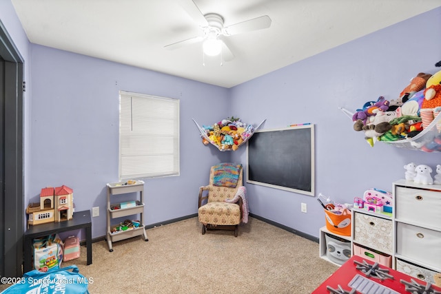 game room featuring carpet flooring, a ceiling fan, and baseboards