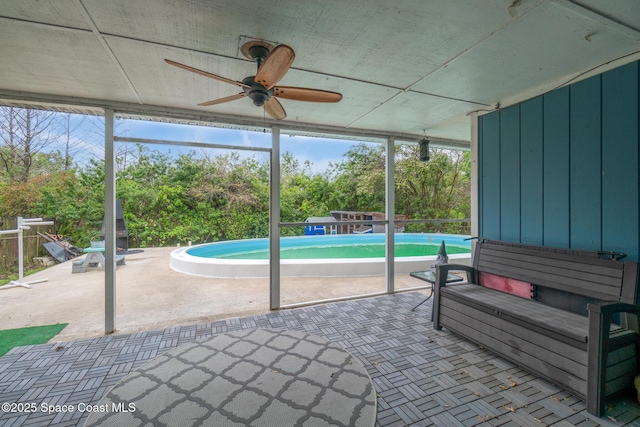 unfurnished sunroom featuring a hot tub