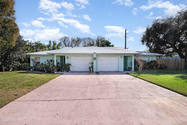 single story home with a garage and a front yard