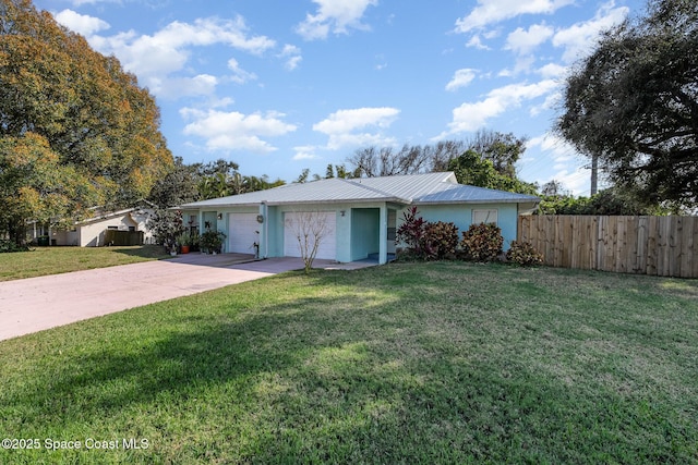 ranch-style home with a garage and a front lawn