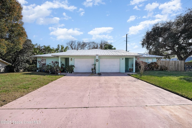 ranch-style house featuring a garage and a front lawn