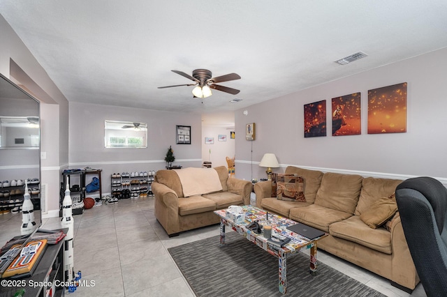 living room with light tile patterned floors and ceiling fan