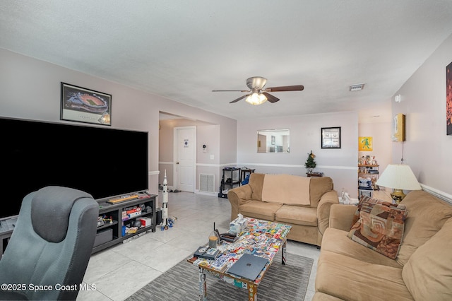 living room with light tile patterned floors and ceiling fan