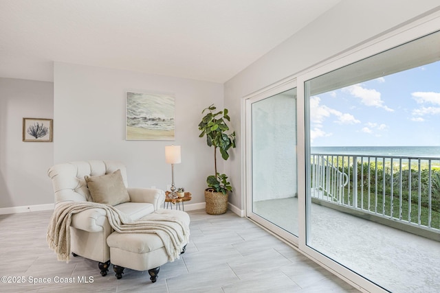 living area with a water view