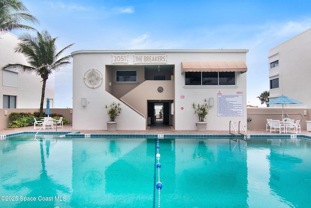 view of swimming pool featuring a patio area