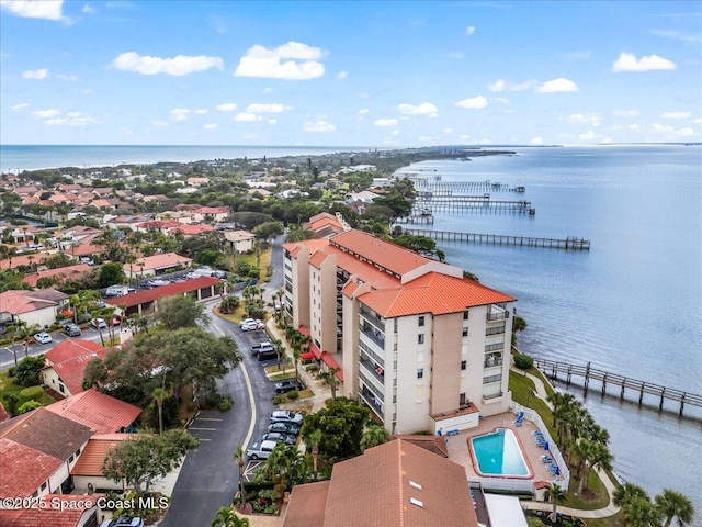 birds eye view of property with a water view