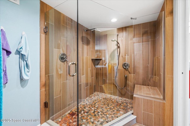 bathroom with a shower with shower door