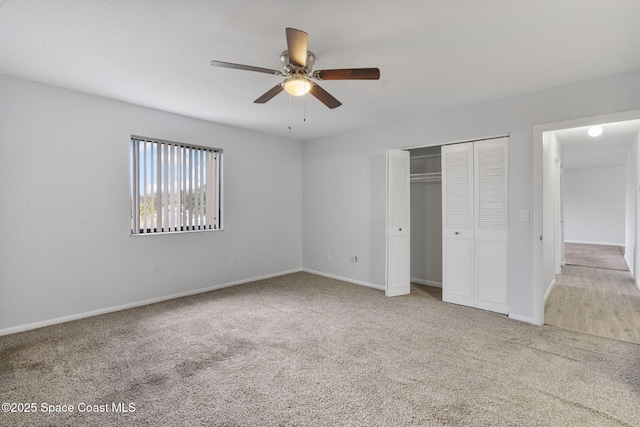 unfurnished bedroom with a closet, ceiling fan, and carpet flooring