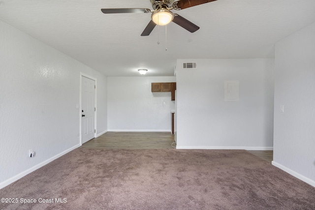 carpeted empty room featuring ceiling fan