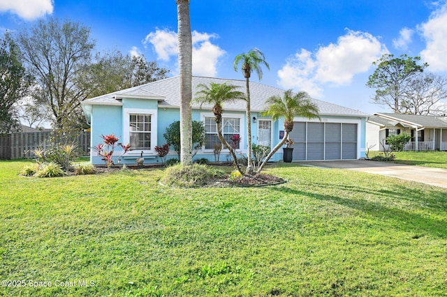 ranch-style home featuring a garage and a front yard