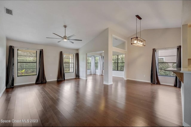 unfurnished living room with dark hardwood / wood-style flooring, plenty of natural light, high vaulted ceiling, and ceiling fan