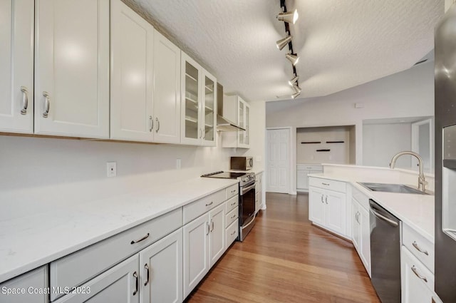 kitchen featuring stainless steel appliances, sink, and white cabinets