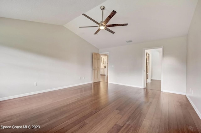 unfurnished room featuring ceiling fan, lofted ceiling, and dark hardwood / wood-style floors