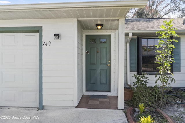 doorway to property featuring a garage