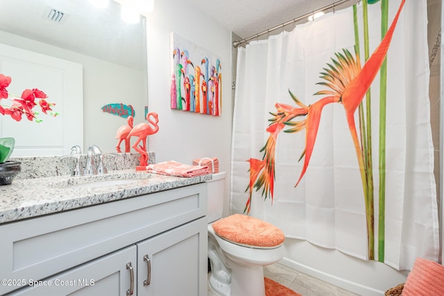 full bathroom featuring vanity, shower / bath combination with curtain, a textured ceiling, tile patterned floors, and toilet