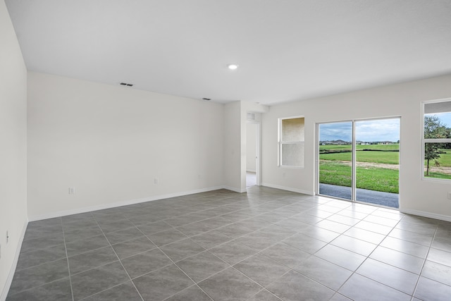 empty room featuring tile patterned flooring