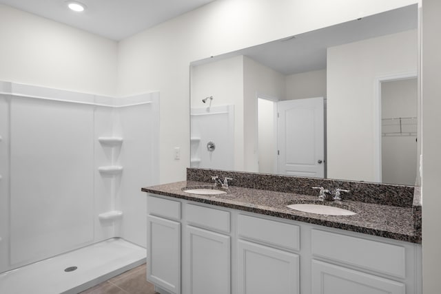 bathroom featuring vanity and walk in shower