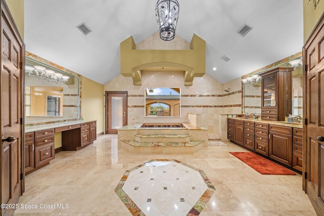 bathroom featuring lofted ceiling, vanity, independent shower and bath, and a textured ceiling