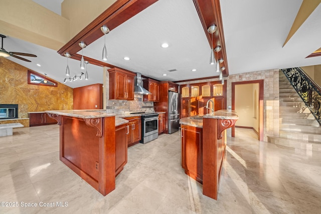 kitchen featuring wall chimney exhaust hood, stainless steel appliances, a breakfast bar area, and a center island with sink