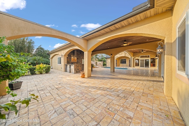 view of patio / terrace featuring area for grilling and ceiling fan