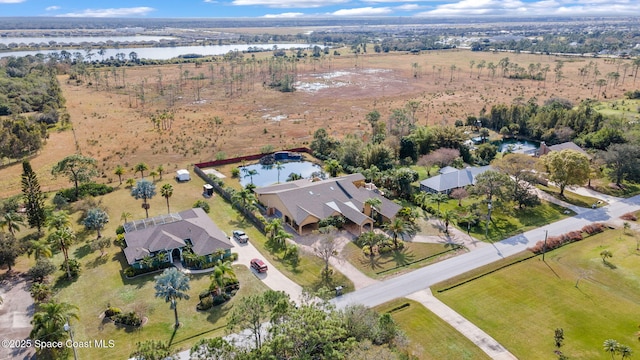 drone / aerial view with a water view and a rural view