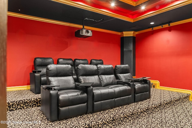 home theater room with crown molding and carpet