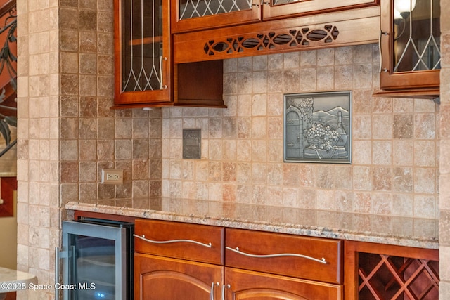 kitchen featuring light stone countertops and beverage cooler