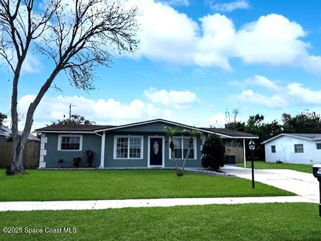 ranch-style home with a carport and a front yard