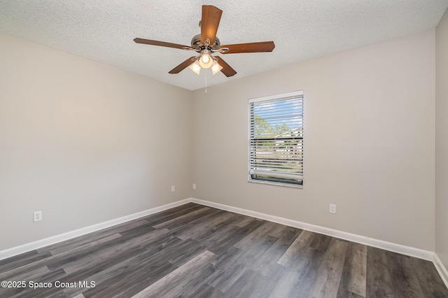 spare room with ceiling fan, dark hardwood / wood-style floors, and a textured ceiling