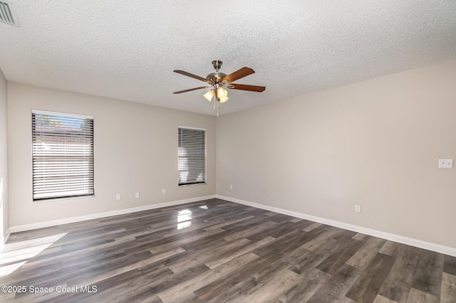 unfurnished room with dark hardwood / wood-style flooring, a textured ceiling, and ceiling fan