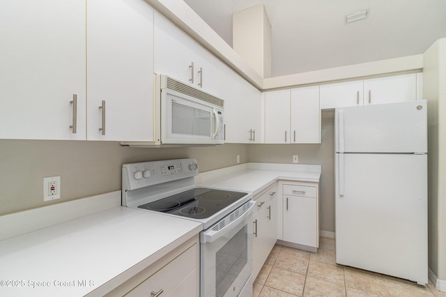 kitchen with white cabinetry, white appliances, and light tile patterned floors