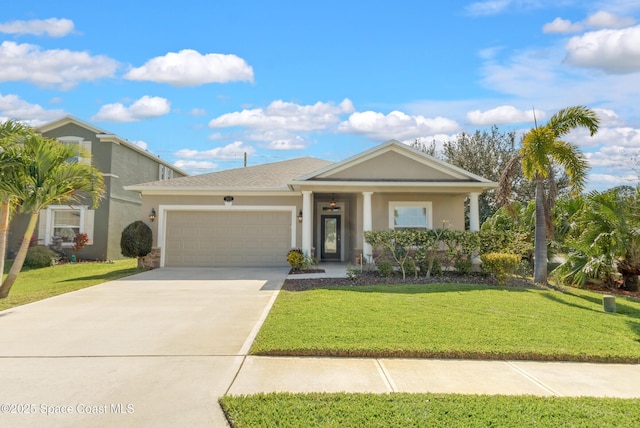 view of front of property featuring a garage and a front yard