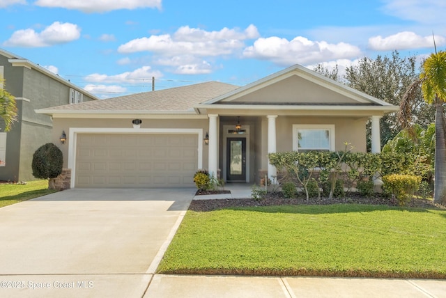 view of front of home with a garage and a front yard