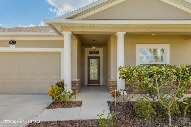 view of exterior entry featuring a garage