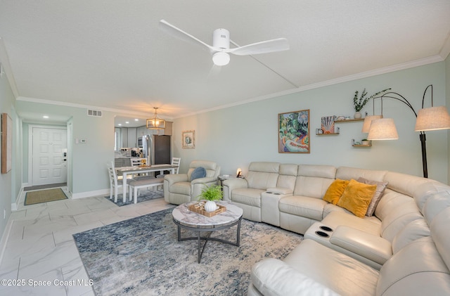 living room featuring crown molding, ceiling fan, and a textured ceiling