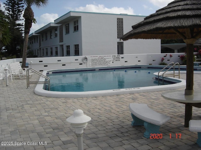 community pool featuring a patio