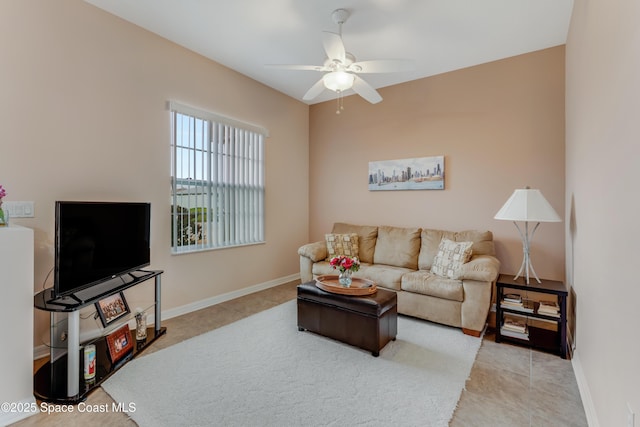 tiled living room featuring ceiling fan