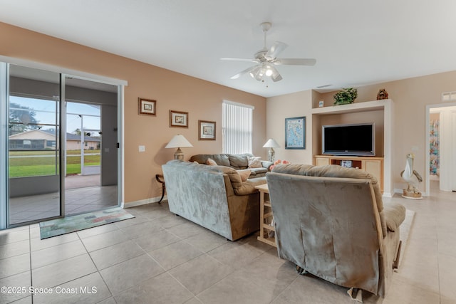 living room with light tile patterned flooring and ceiling fan