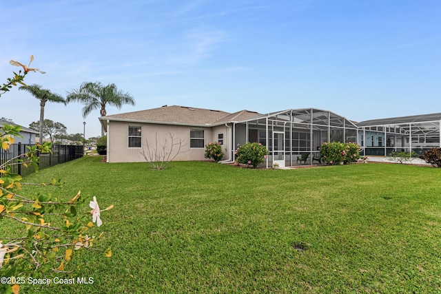 back of property featuring a yard