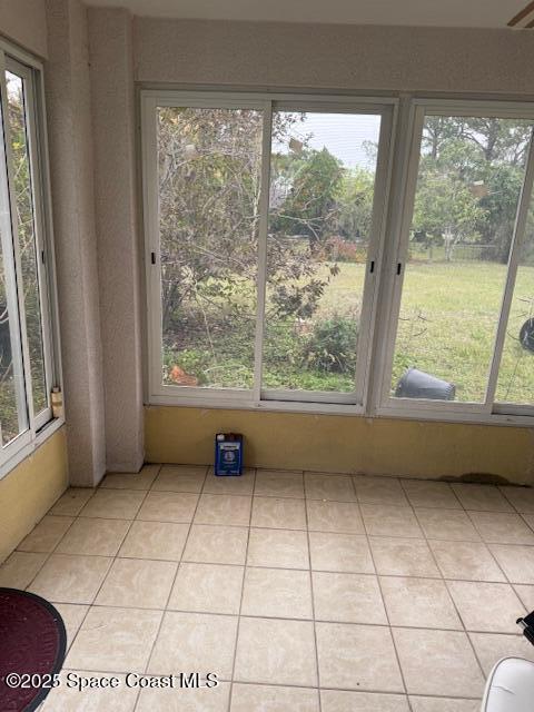 unfurnished sunroom with a healthy amount of sunlight